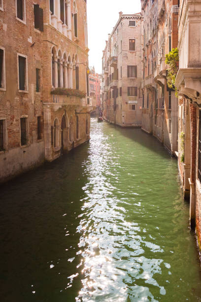 istock Narrow canal in Venice, Italy. 1353631041