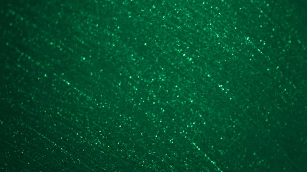 istock Christmas Green Glitter Background Abstract Bokeh Pattern Glittering Emerald Teal Dark Chiffon Textile Texture Fantasy St. Patrick's Day Shiny Dust Particle Circle Backdrop Macro Photography Soft Focus 1353631782
