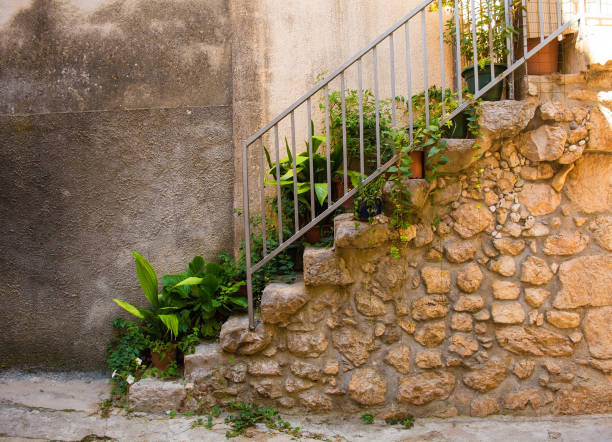 Steps in quiet residential street in the historic medieval centre of Vrbnsk hill village on Krk Island in the Primorje-Gorski Kotar County of western Croatia