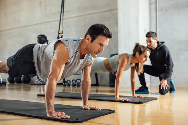 istock Man and woman training together 1353633245