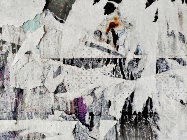 istock Old ripped blank torn grunge posters texture background 1353634296