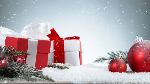 istock Christmas gits with decorations on snow 1353634677