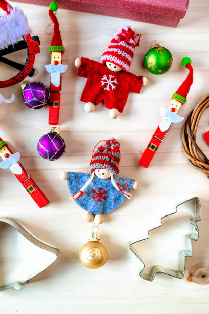 istock Christmas ornaments on wooden background 1353639646