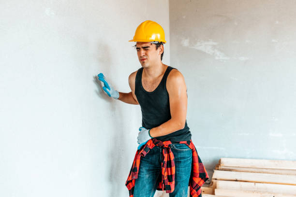 istock Young worker with hip pain on a construction site. 1353639798