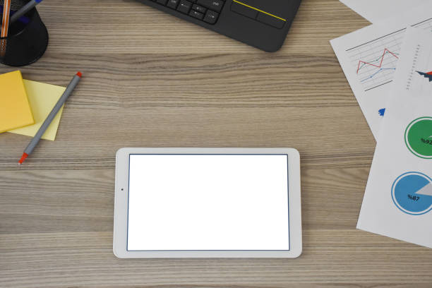istock Digital tablet on the desk with office supplies 1353639975