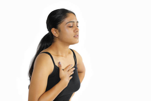 istock Female Clutching Chest in Pain 1353645224