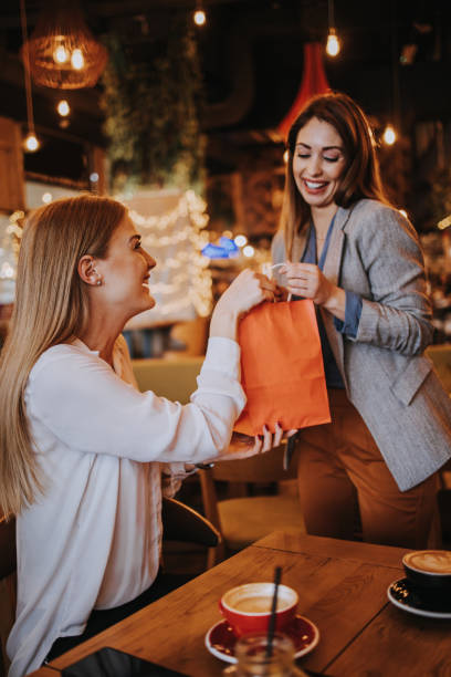 istock Two best friends in coffee bar 1353648412