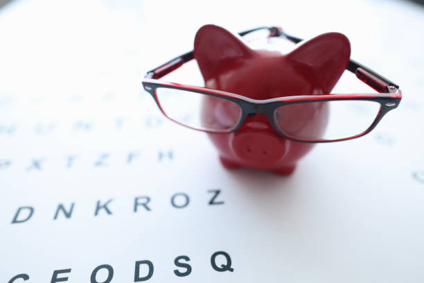 istock Red pig in glasses stands on ophthalmological table closeup 1353648812