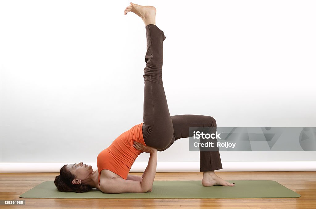 Yoga floor position Woman holds an extended bridge yoga pose Stretching Stock Photo