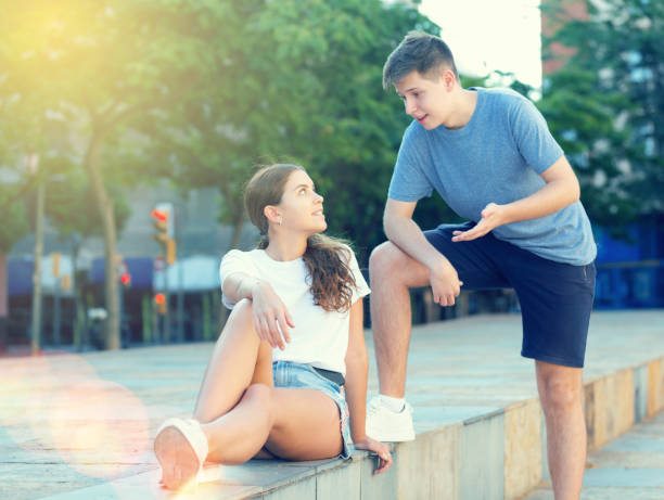 istock Young man is having a conversation with girl 1353649950