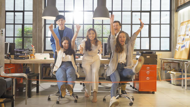 istock A Relax happy group of multi ethnic business team employee people having fun, doing activity together in party in meeting room office. Business analysis. People lifestyle. Celebration. Cooperation 1353650730
