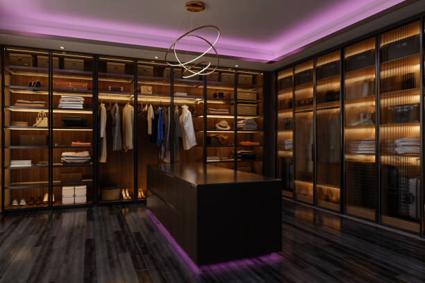 Luxurious Dressing Room Interior With Walk-In Closet And Pink Neon Lighting Luxurious Dressing Room Interior With Walk-In Closet And Pink Neon Lighting dark pink dress stock pictures, royalty-free photos & images