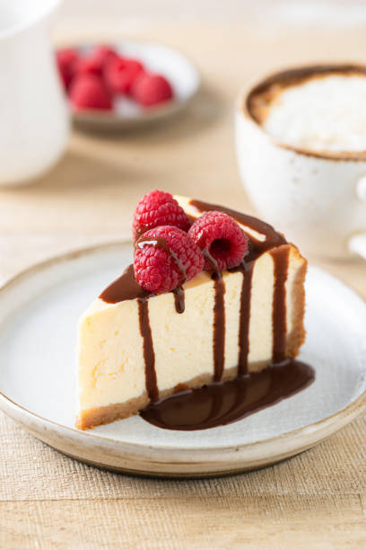istock Slice of cheesecake with chocolate sauce 1353654516