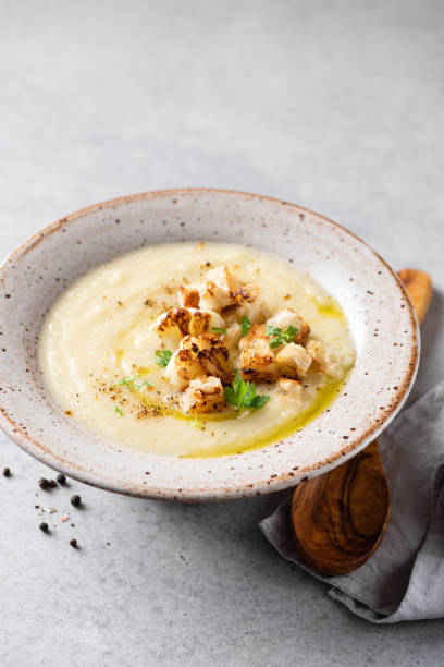 istock Vegan cauliflower cream soup with bread croutons 1353655063
