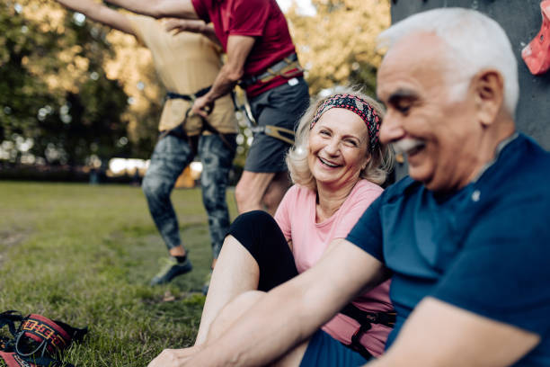 istock Group of seniors having a sport climbing training 1353655691