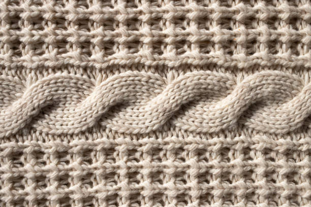 istock Woolen knitted sweater texture. Close-up, top view. 1353657146
