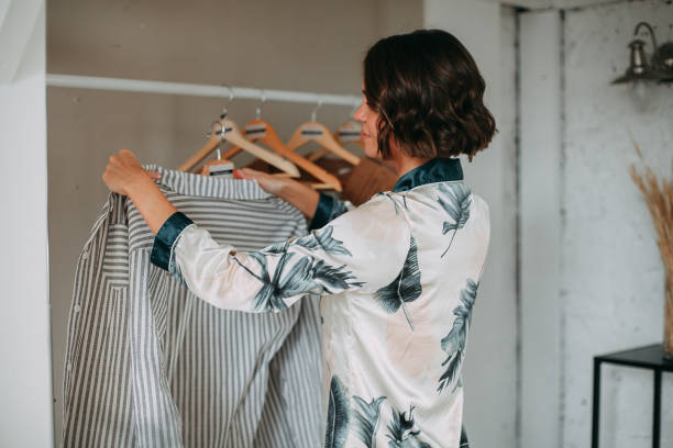 istock Young girl hanging clothes 1353658759