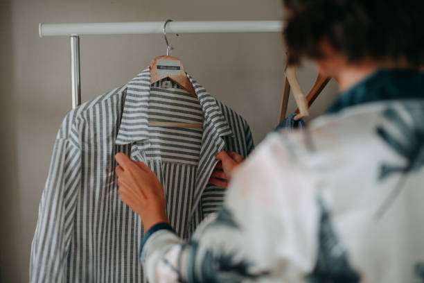 istock Young girl hanging clothes 1353658774