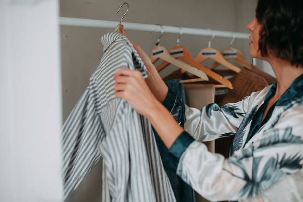 istock Young girl hanging clothes 1353658795