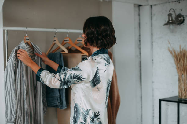 istock Young girl hanging clothes 1353658838
