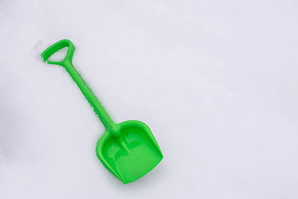 Shovel children toy. Kinds shovel in fresh snow.