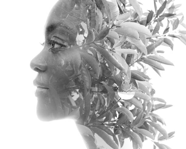 istock A profile portrait combined with fresh foliage in a double exposure technique. 1353661388