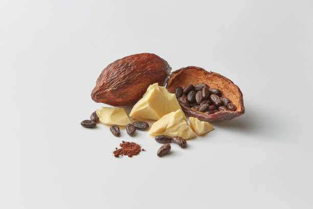 Cocoa beans in pods and butter stock photo