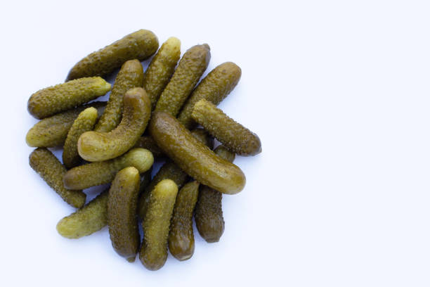 istock Pickled gherkins or cucumbers on white background. 1353662478