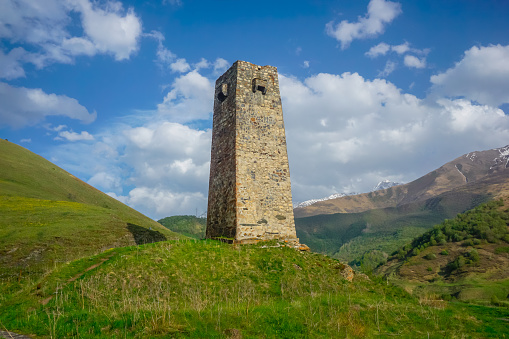 Ancient stone tower in the mountains