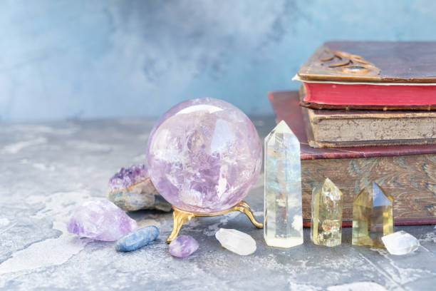 Healing crystals concept Gemstones set for relax and meditation. Magic ball and semipresious minerals for Reiki life balance with books in background, healing Crystal Ritual, Witchcraft, spiritual esoteric practice. chakra recovery energy gem stock pictures, royalty-free photos & images