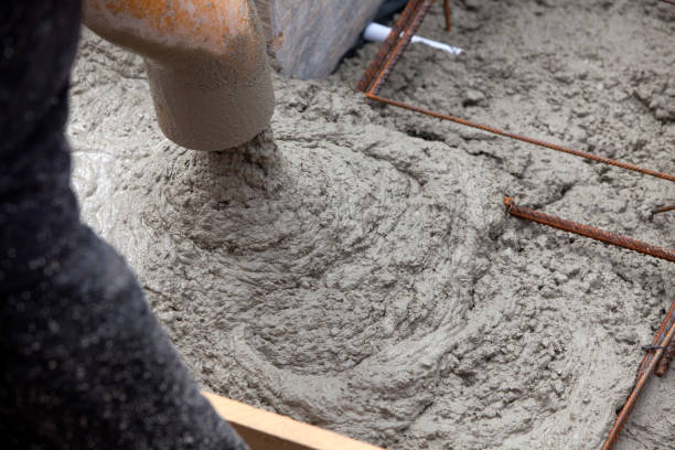 istock Construction of building foundation. Pouring with liquid concrete of formwork with reinforced iron. Construction home. 1353663941