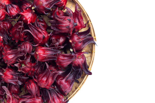 istock Roselle flower in round bamboo basket on white background. 1353663942