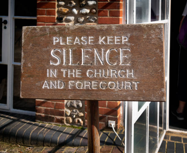 istock 'Please keep silence in the church and forecourt' - sign 1353664537