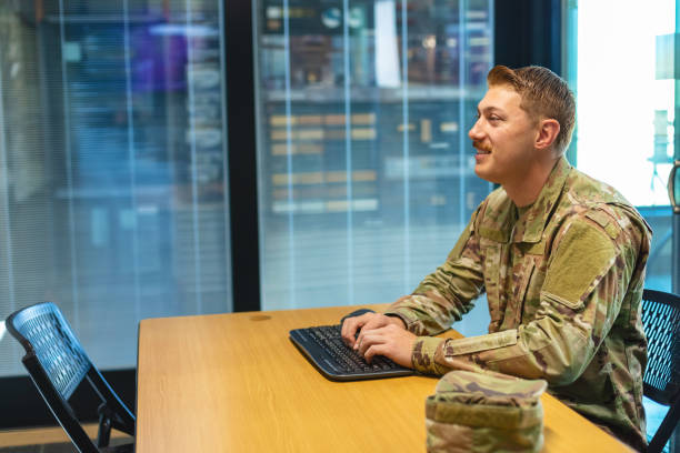 istock Professional Working Caucasian Male National Guard Officer in Office Setting Using Technology Photo Series 1353665950