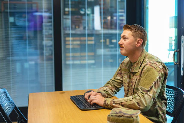 istock Professional Working Caucasian Male National Guard Officer in Office Setting Using Technology Photo Series 1353665990