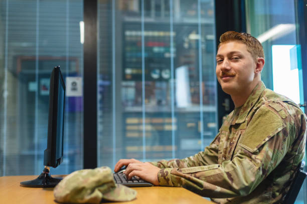 istock Professional Working Caucasian Male National Guard Officer in Office Setting Using Technology Photo Series 1353666033