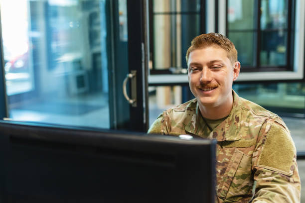 istock Professional Working Caucasian Male National Guard Officer in Office Setting Using Technology Photo Series 1353666628