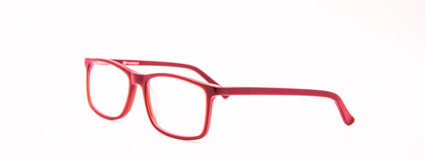 istock Close-Up Of Red Eyeglasses Against White Background 1353666823