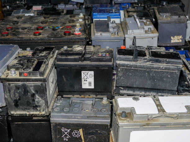 istock Pallet with many used car batteries for recycling 1353666907