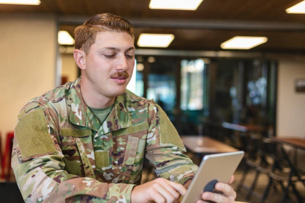 istock Professional Working Caucasian Male National Guard Officer in Office Setting Using Technology Photo Series 1353667025