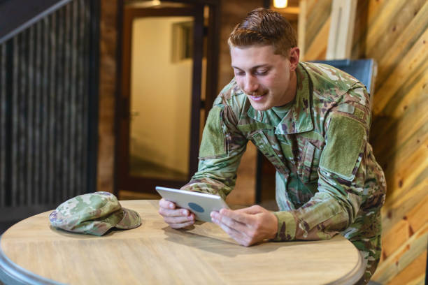istock Professional Working Caucasian Male National Guard Officer in Office Setting Using Technology Photo Series 1353667196