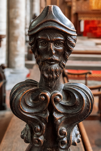 A carved wooden pew end in King’s Lynn Minster, St Margaret’s Church, King’s Lynn, Norfolk, Eastern England.