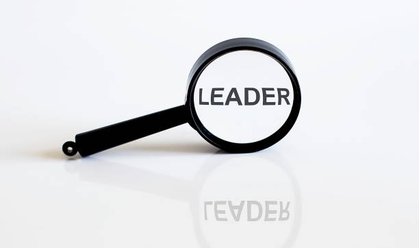 istock Magnifier with text LEADER on the white background 1353667926