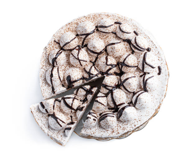 istock Sponge cake decorated with small meringue isolated on white 1353668206