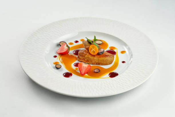 istock Fried foie gras with berry sauce in a white plate on a white plate 1353670121