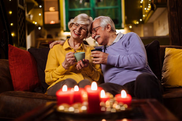 Our love remains the same throughout the years Shot of a senior couple having coffee together at home Senior Years stock pictures, royalty-free photos & images