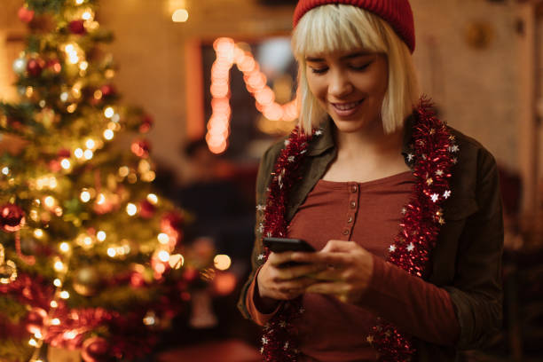 istock Checking the photos of her Christmas tree 1353675624