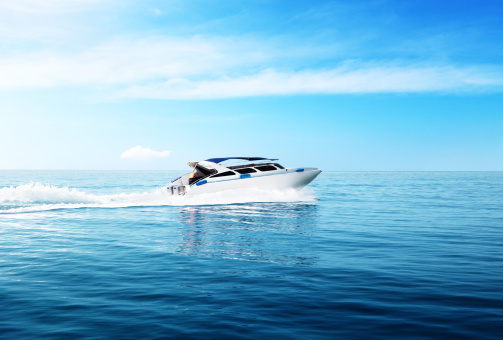 Aerial view of luxury yacht moving fast at Adriatic sea during sunny day.