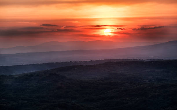 istock Sunset with layers of mountains 1353678856