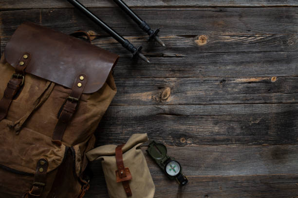 trekking equipment on wooden background